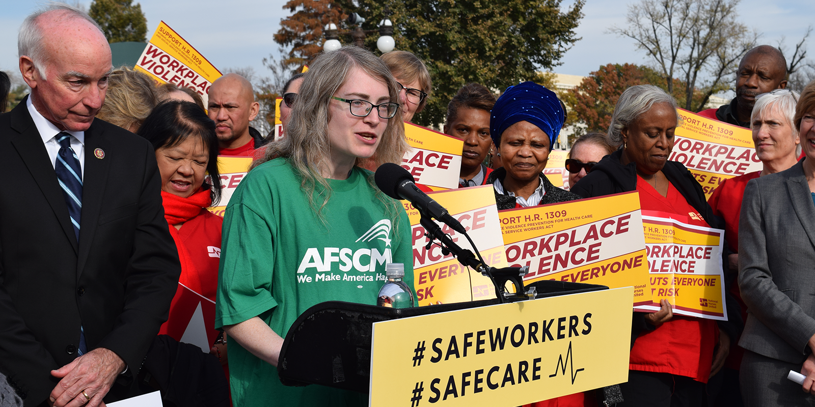 AFSCME member and social worker Miriam Doyle speaks at rally with Rep. Joe Courtney